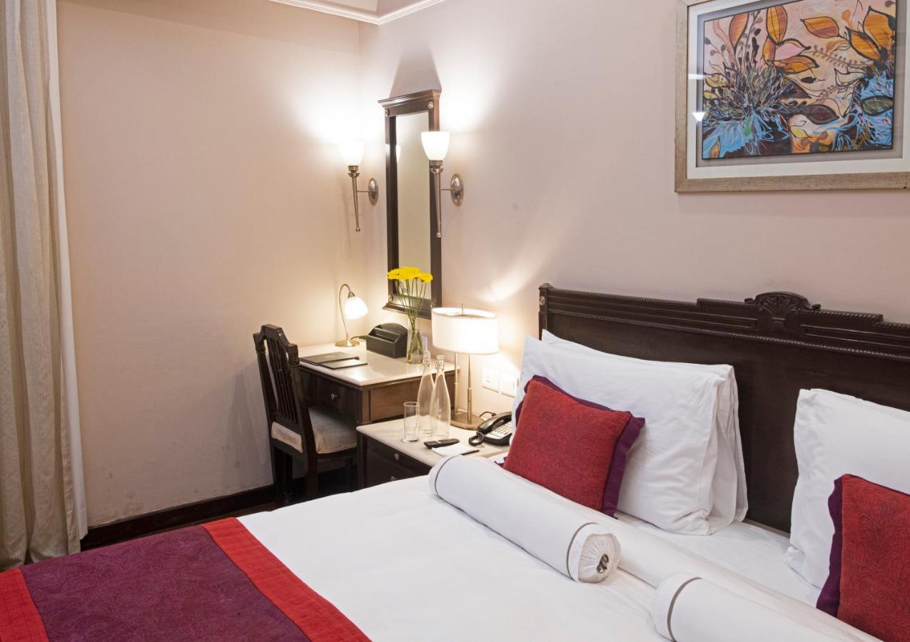 The Claridges New Delhi Hotel Exterior photo A room at the hotel