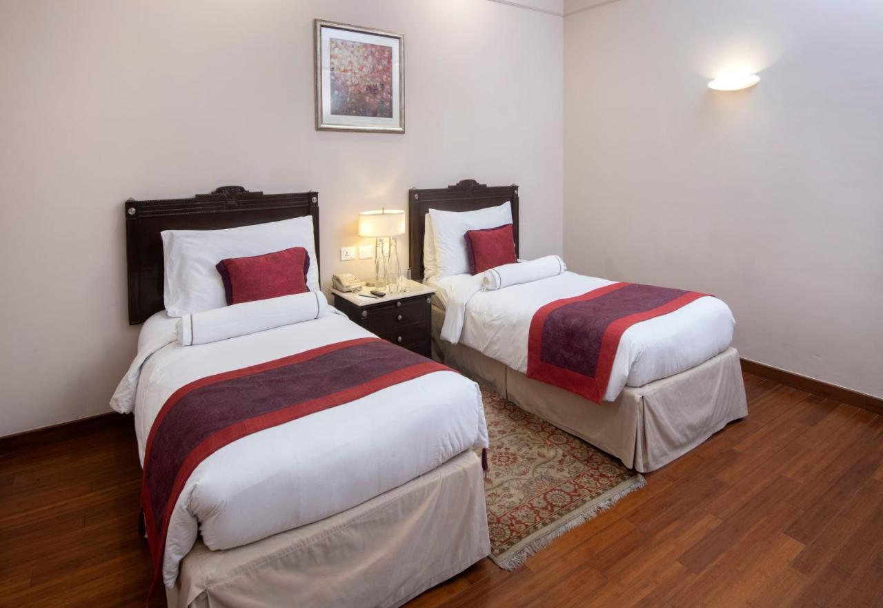 The Claridges New Delhi Hotel Exterior photo A room at the hotel