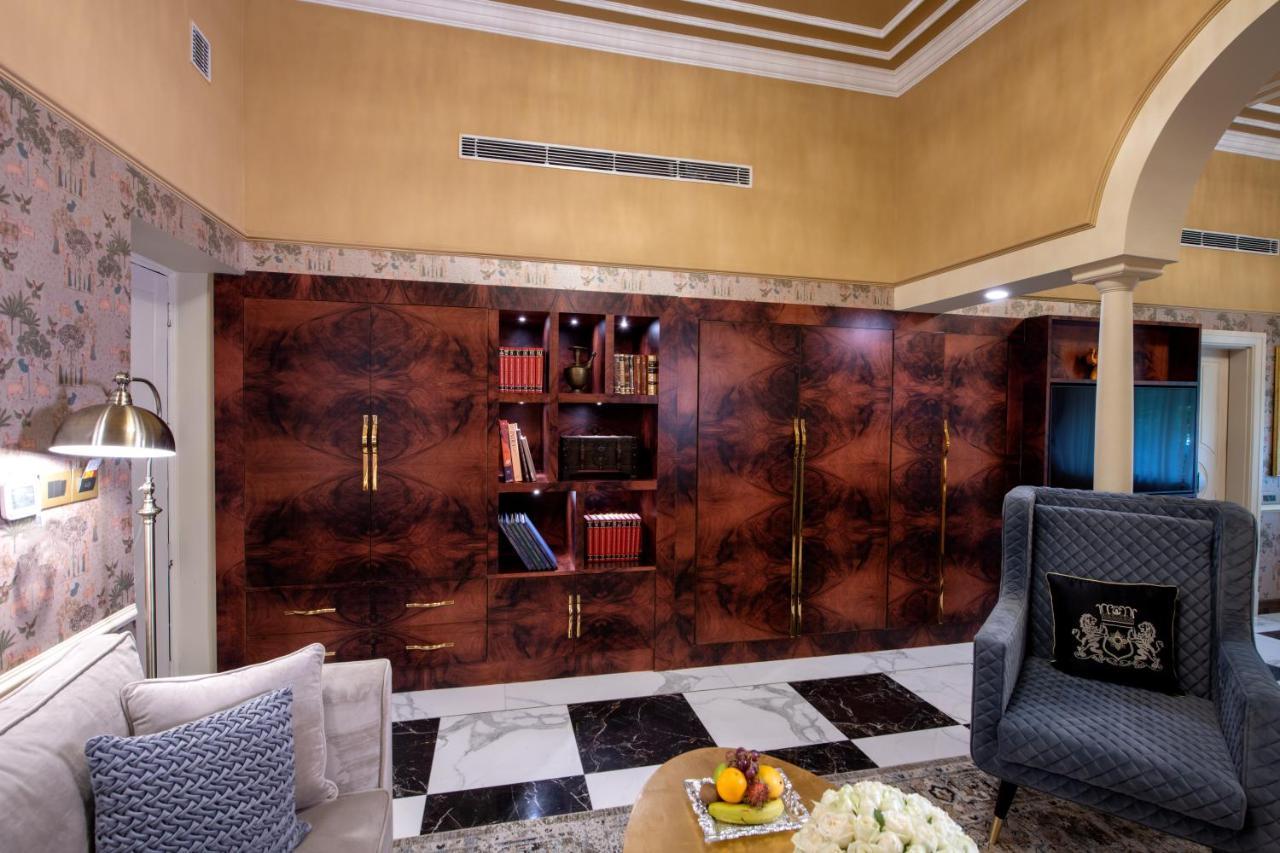 The Claridges New Delhi Hotel Exterior photo A living room in the hotel
