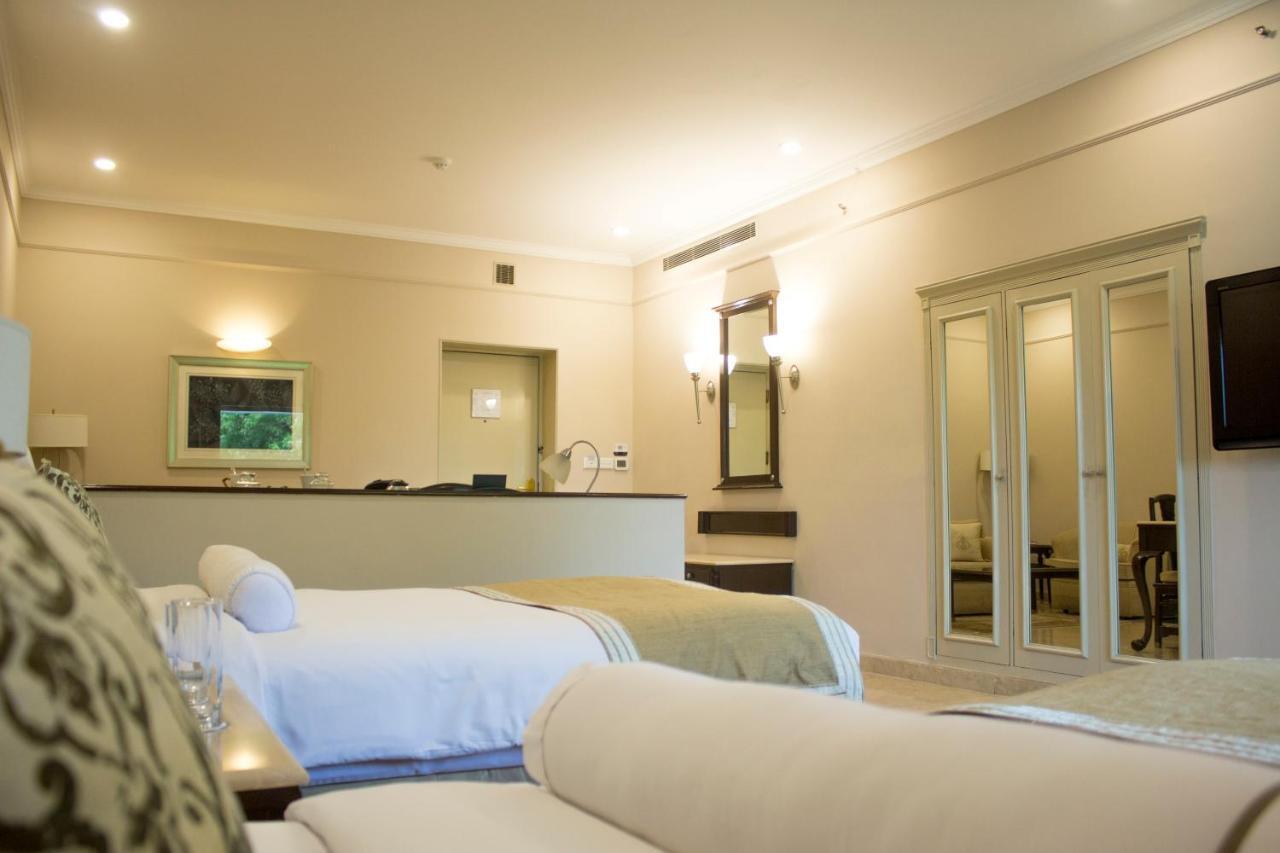 The Claridges New Delhi Hotel Exterior photo A room at the hotel